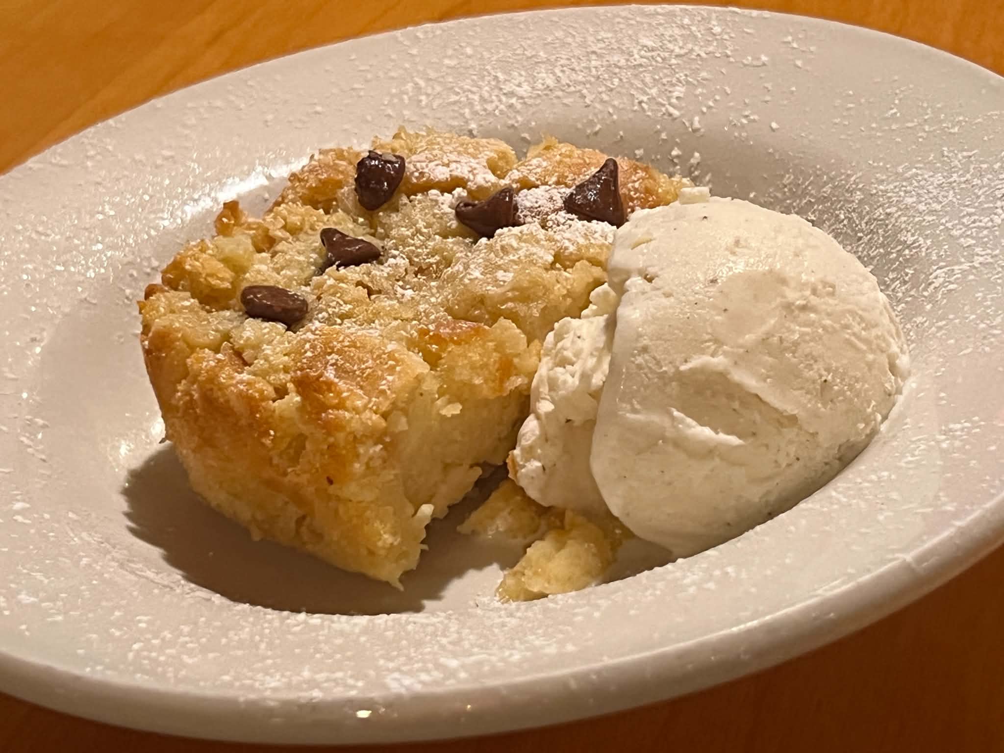 Bread pudding with chocolate chips and vanilla ice cream