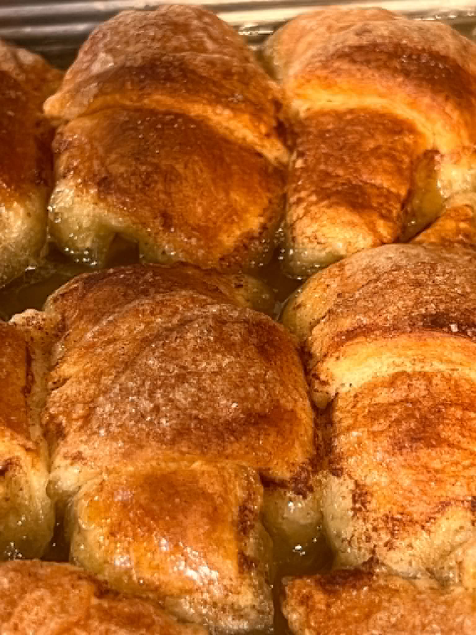 French toast dusted with powdered sugar, served with bacon